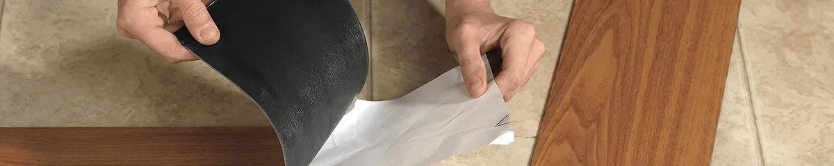 A professional installing vinyl flooring in Clearwater, FL